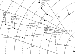 Section of an air traffic control display, showing aircraft symbols, and airspace features (ranges, navigation fixes, etc.). All of the symbols are black against the white background, producing a cluttered display.